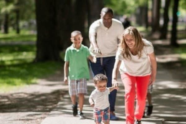 Family walking around in Rochester, New York near Westview Commons Apartments