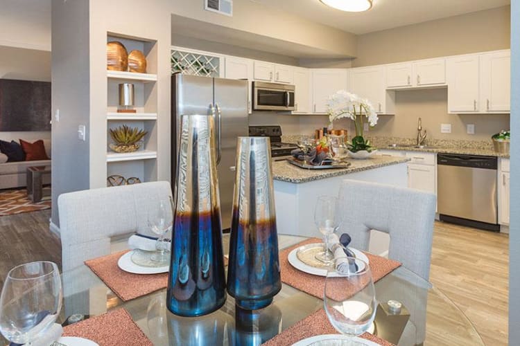 Dining room and kitchen view at Retreat at Cheyenne Mountain Apartments