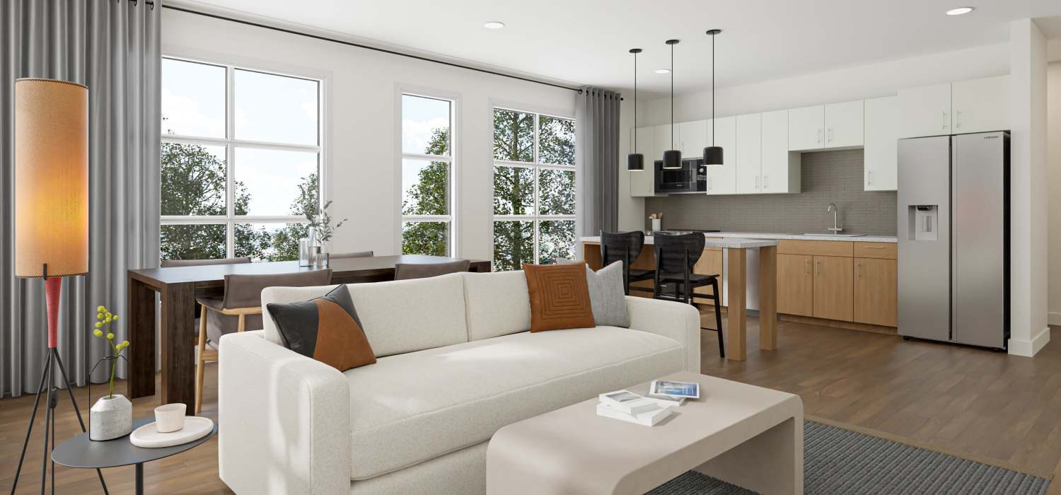 Bright living room with large windows at St. Albans Lofts in Raleigh, North Carolina,