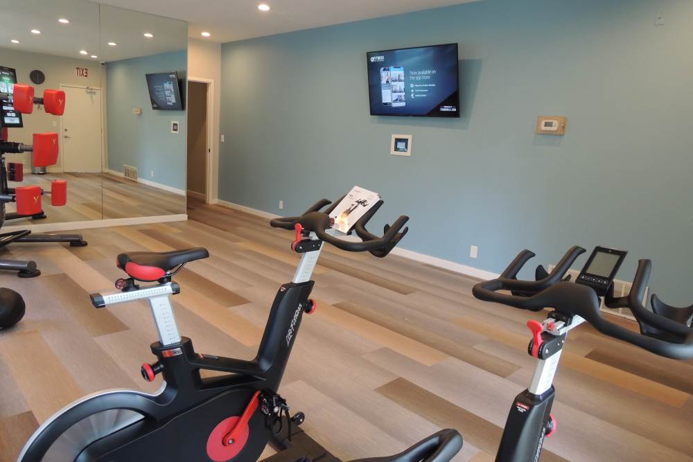 Fitness center with cycling at Royal Farms Apartments in Salt Lake City, Utah