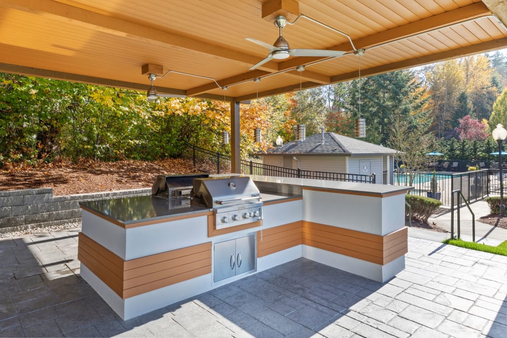 Covered grill and picnic area at Pebble Cove Apartments in Renton, Washington