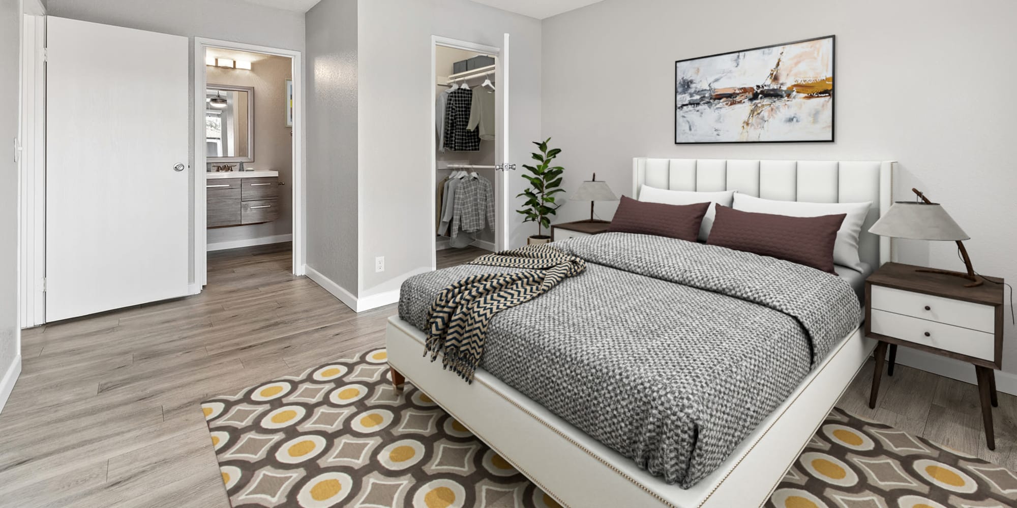 Bedroom with attached bathroom at Trails at Grand Terrace in Colton, California