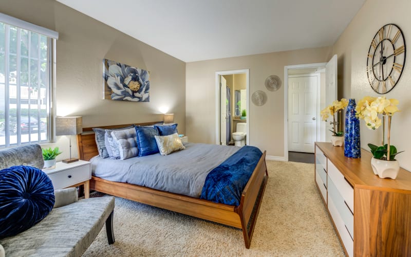 Spacious master bedroom with plush carpeting at Village Oaks in Chino Hills, California