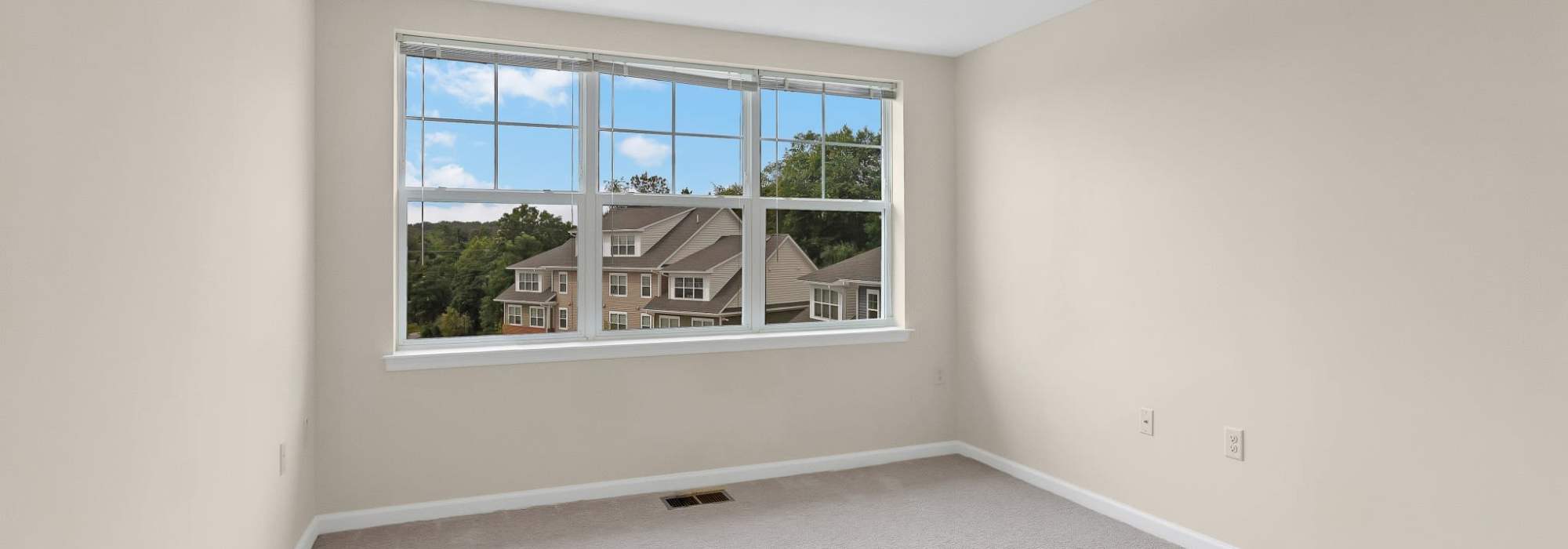 Bedroom with large windows at Robinson Overlook in Columbia, Maryland
