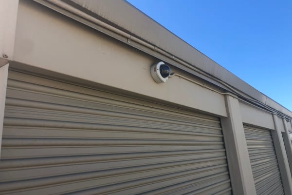 Drive-up outdoor storage units with a security camera at Gold River Self Storage in Gold River, California. 