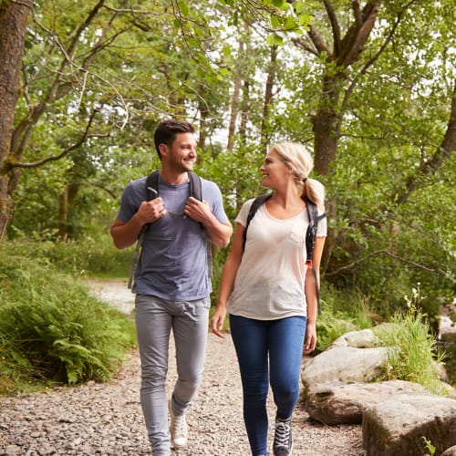 A couple takes a nature hike near The Hardison in Salt Lake City, Utah