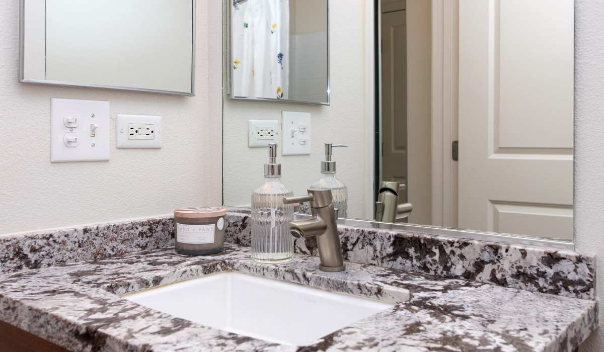 Bathroom with mirror at 1010 Pacific in Santa Cruz, California
