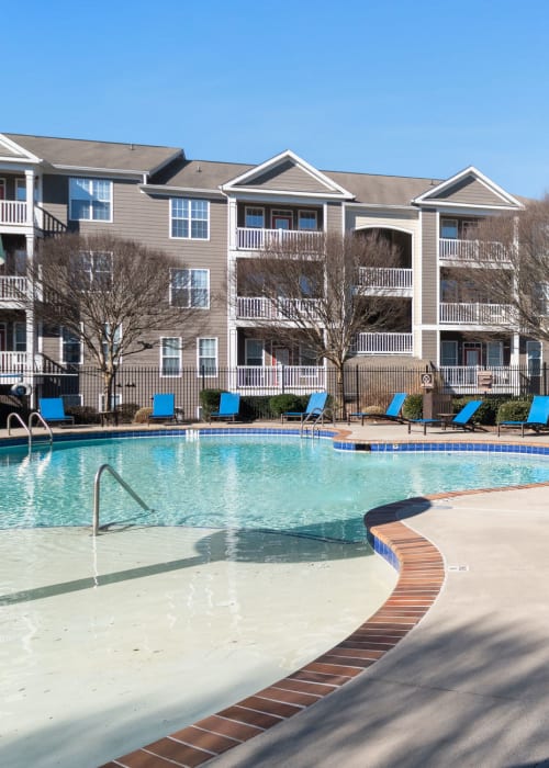 Outdoor pool with chairs at Southwood Vista in Atlanta, Georgia