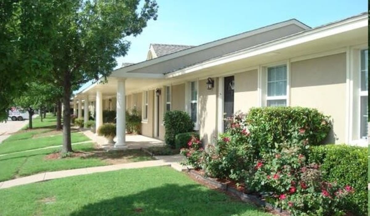 Grassy area and entrance to Paragon Apartments in Lawton, Oklahoma