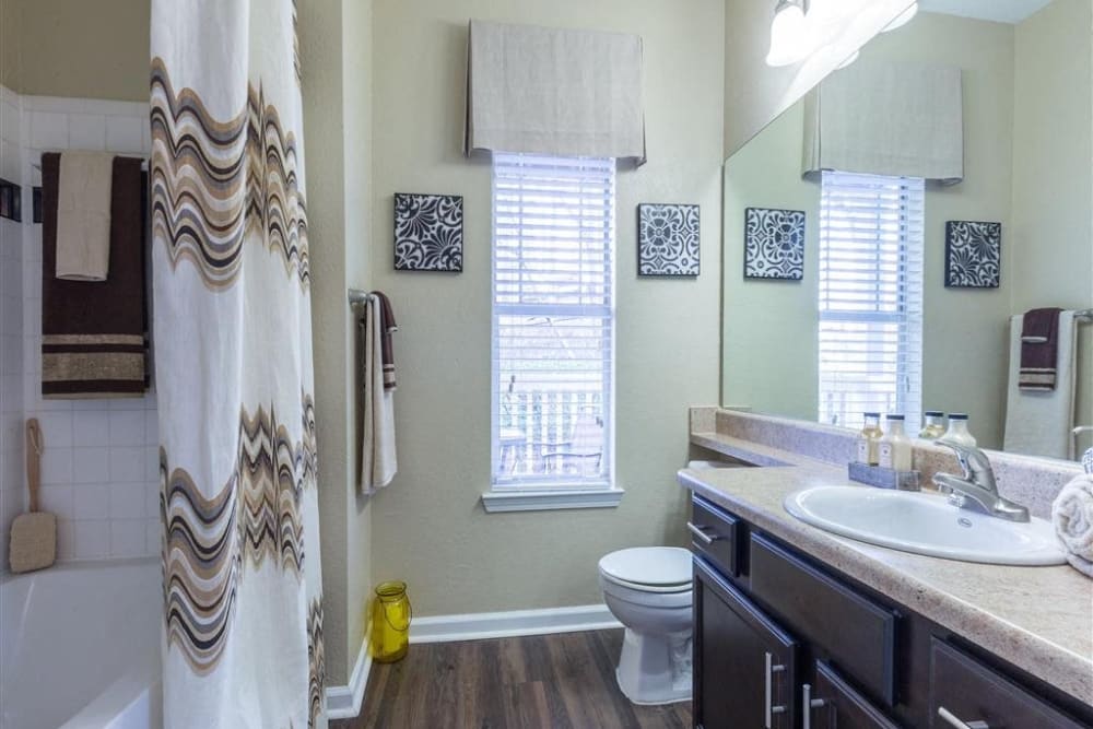 Model bathroom with a double vanity and walk-in closet at Chattahoochee Ridge in Atlanta, Georgia
