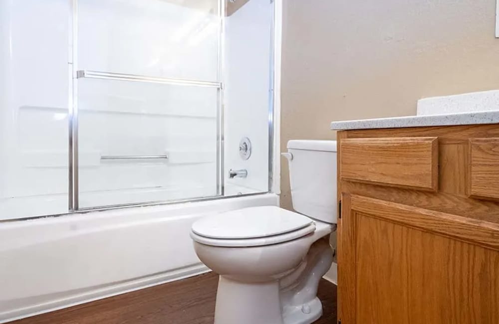 Bathroom with white tile shower at Park Club Apartments in Rohnert Park, California