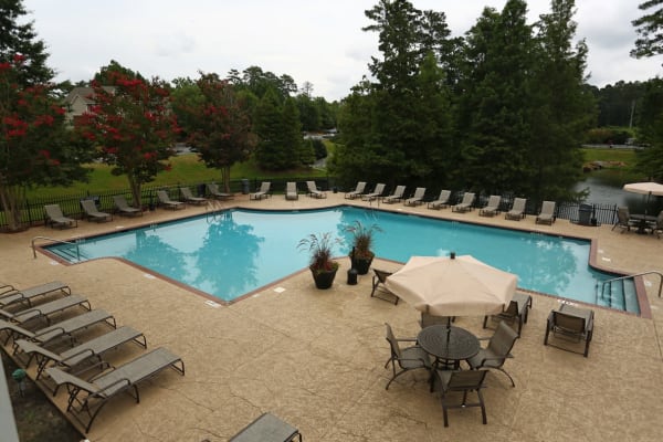 Pool with chairs at Broad River Trace in Columbia, South Carolina
