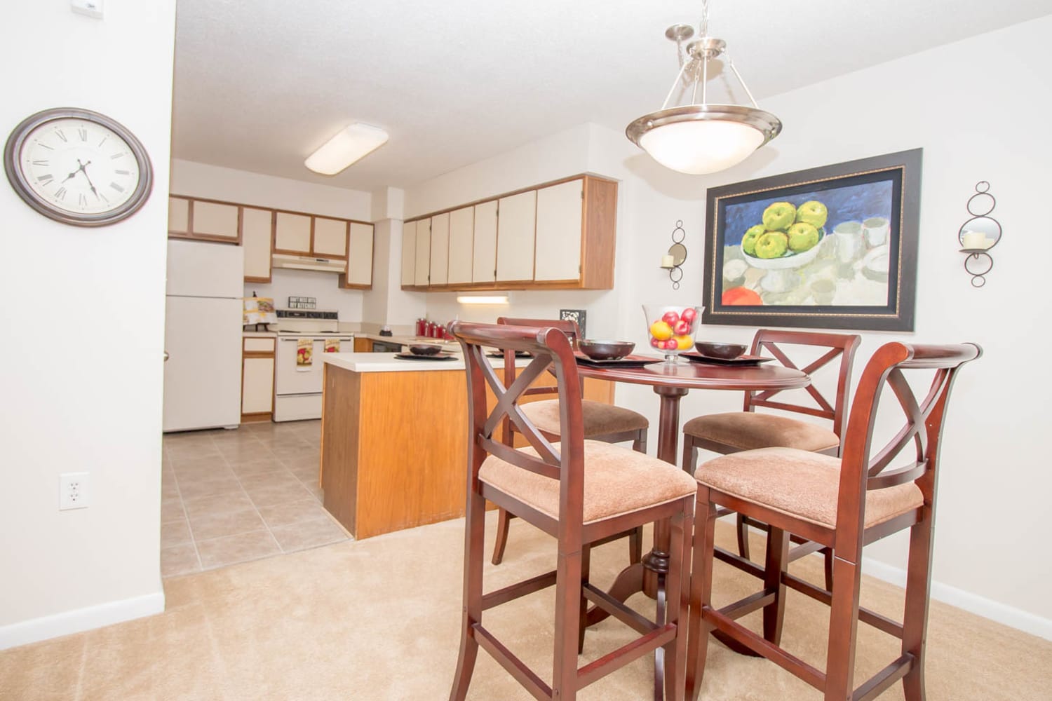 Dining area and kitchen of a model home at River Park Tower Apartment Homes in Newport News, Virginia