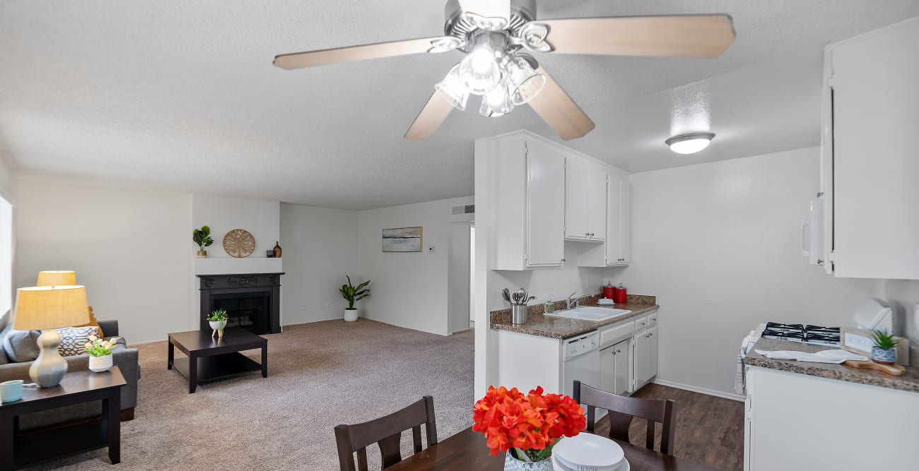 Upgraded and spacious view of the living room and kitchen from the open concept dining room at the Hallmark Apartment in Sherman Oaks