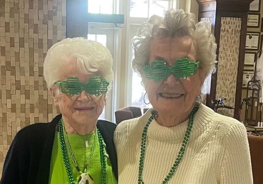 Two residents enjoying a party at Truewood by Merrill, Keller in Keller, Texas.