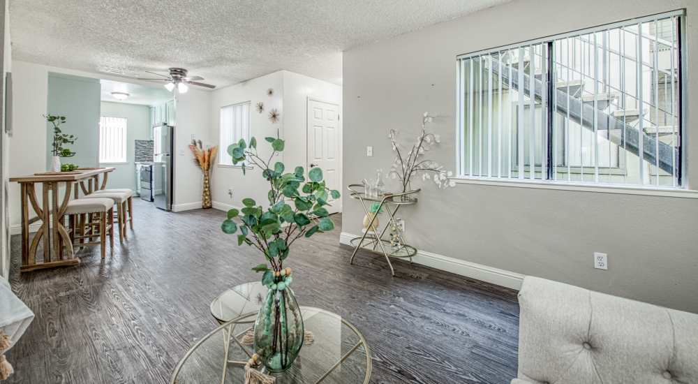 Thoughtfully designed living room with plenty of natural light at The Landing at Fancher Creek in Fresno, California