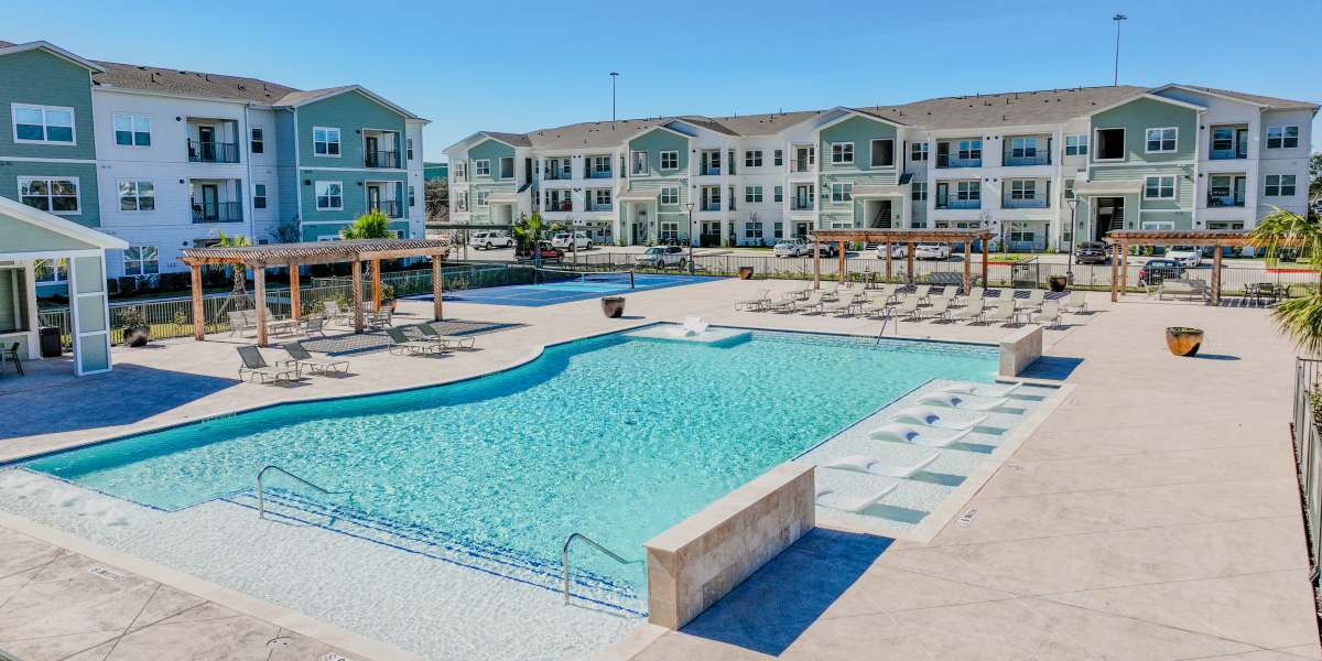 Community exterior with pool at Meridian City Park in Houston, Texas