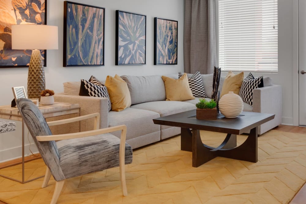 Model living room with door to balcony at Olympus Highlands North in Albuquerque, New Mexico