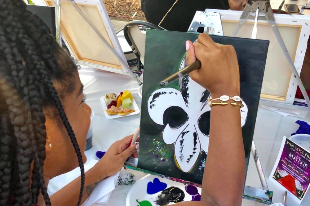 Making a cool art project at a resident event at The Mayfair Apartment Homes in New Orleans, Louisiana