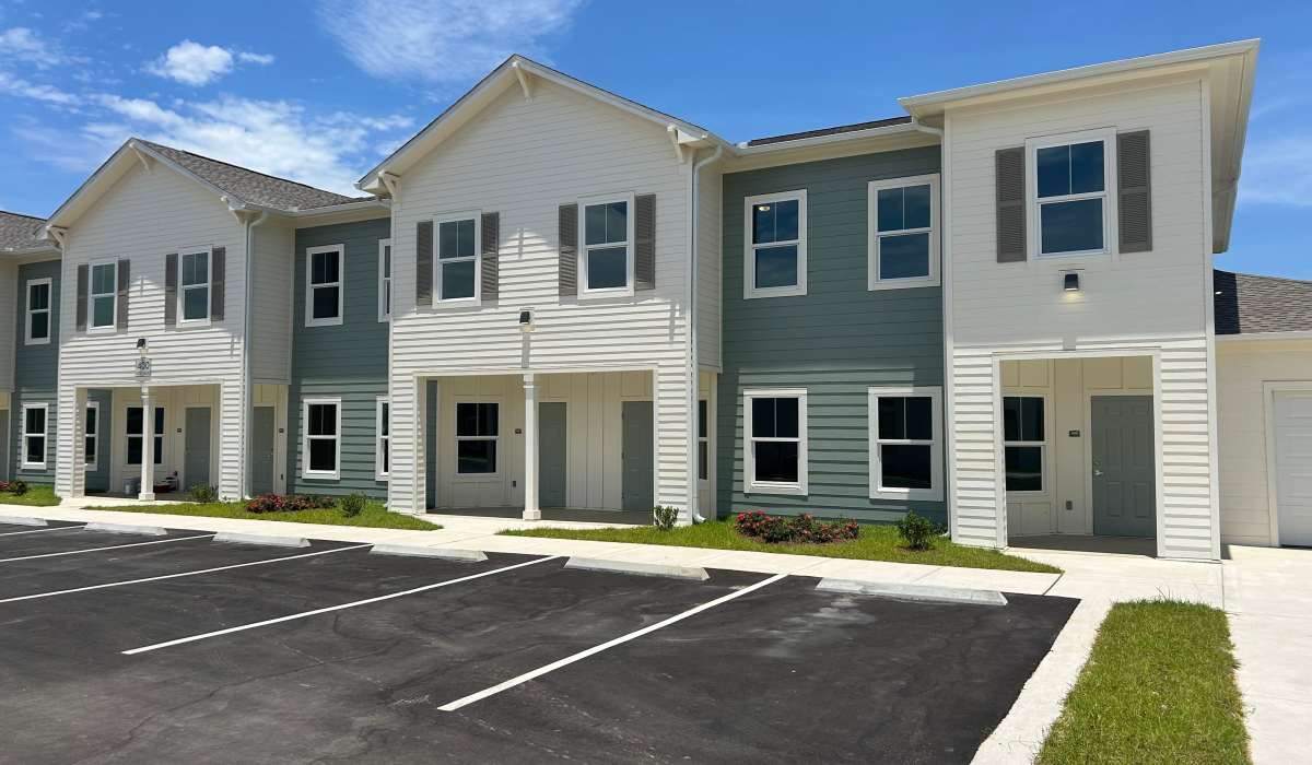 Exterior view of the community with parking spaces at Las Colinas in Foley, Alabama