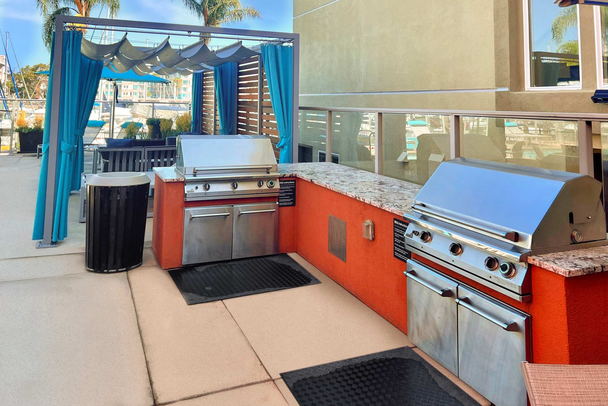 Rooftop lounge with BBQ grilling station at Harborside Marina Bay Apartments in Marina del Rey, California
