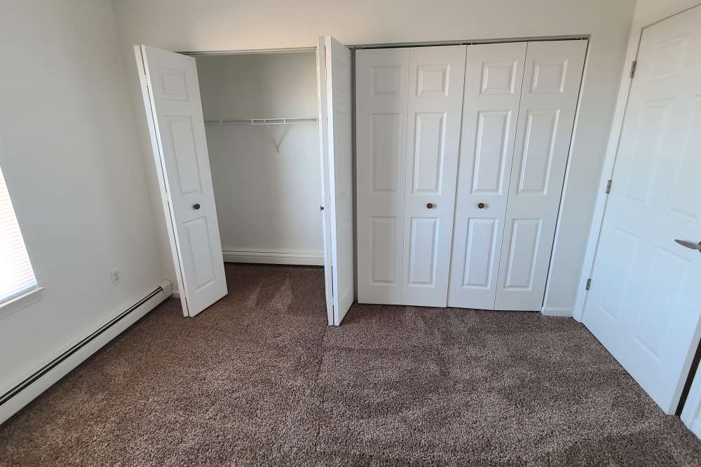 Unfurnished bedroom with walk-in closet at Manistique Lakeview in Manistique, Michigan