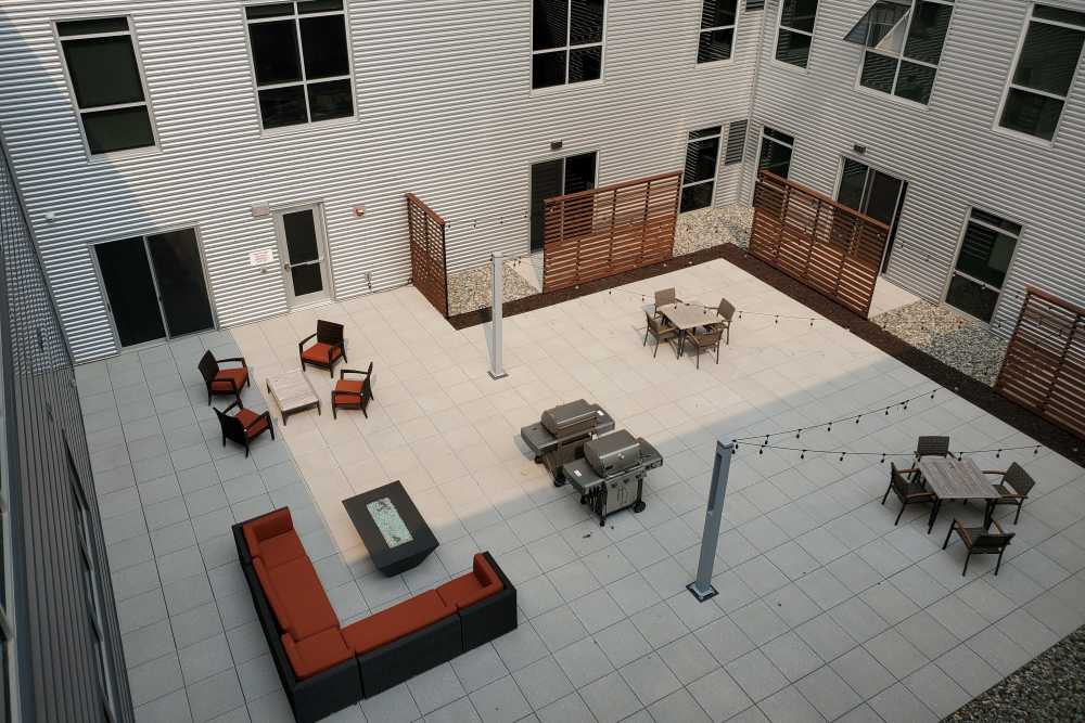 Community patio with grilling at Skyline Tower in Fort Wayne. IN