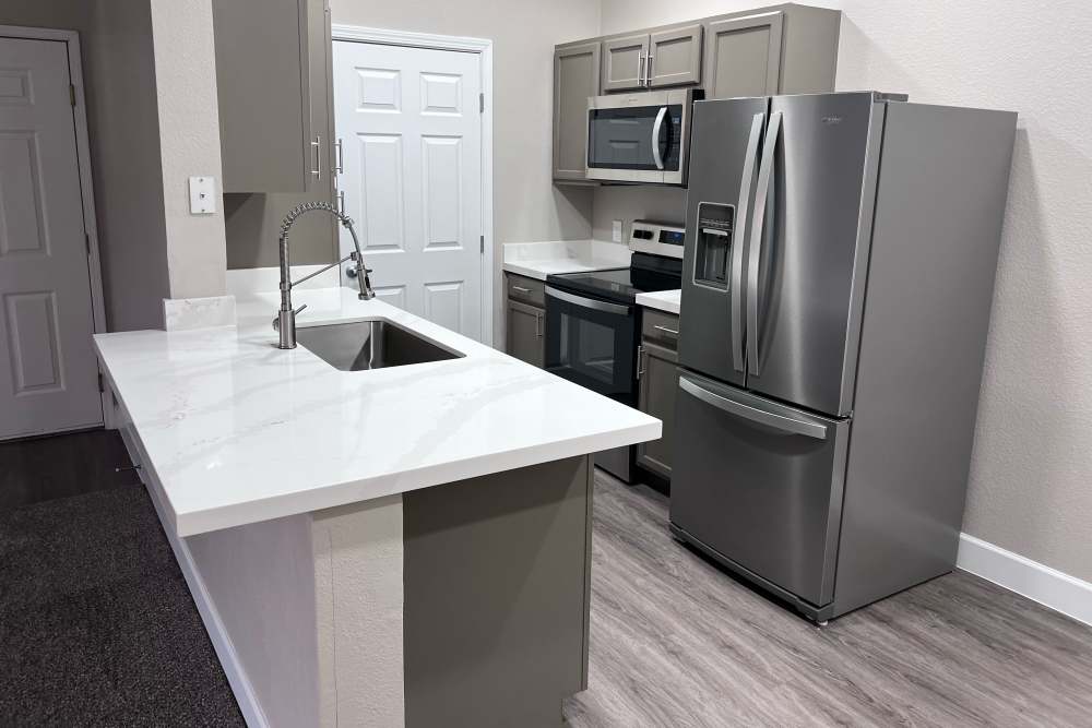 Modern kitchen with stainless appliances at Canyon Vista in Sparks, Nevada