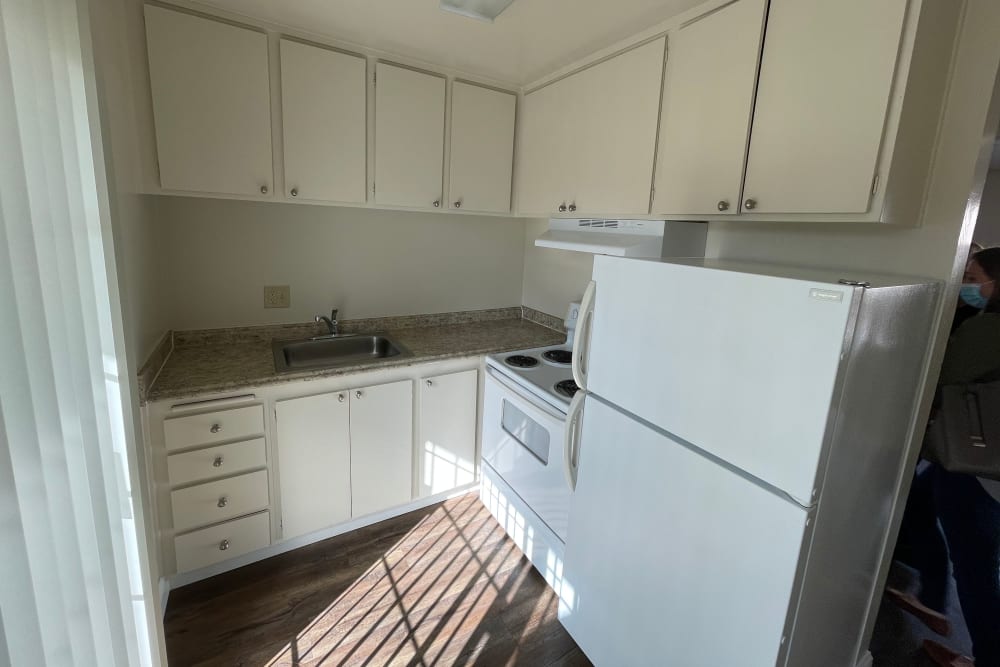 Model kitchen with bright cabinetry at Mountain View Apartments in Concord, California