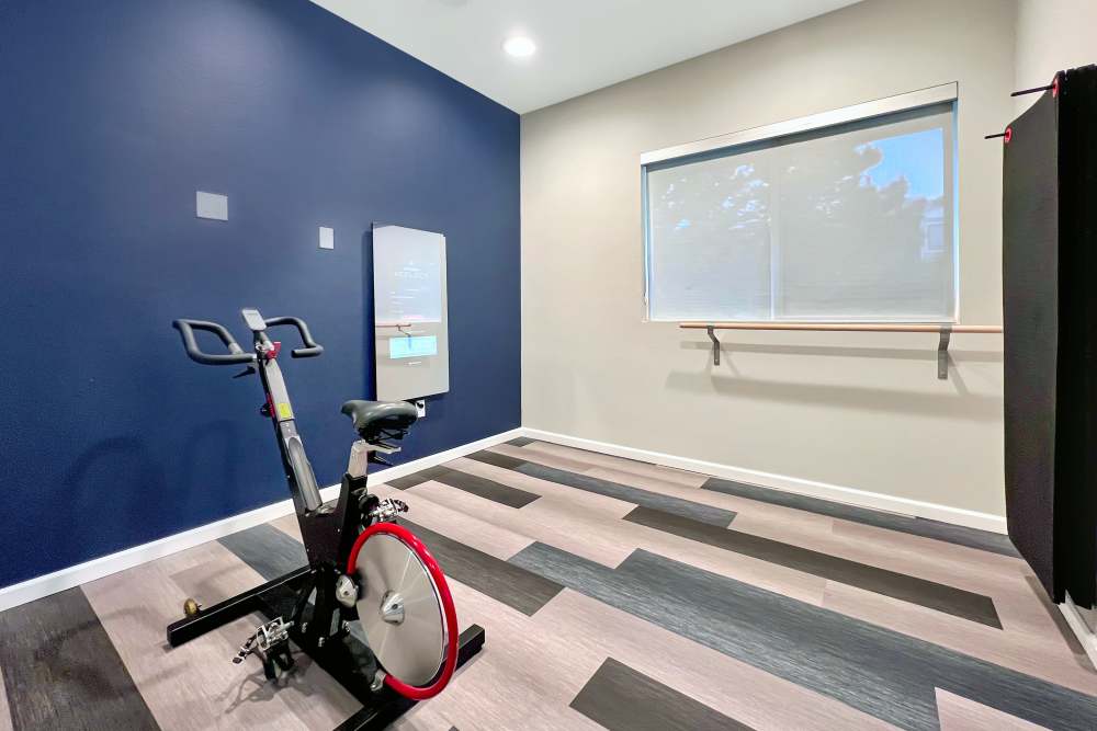 Fitness On Demand Room with Mirror at Alton Green Apartments in Denver, Colorado