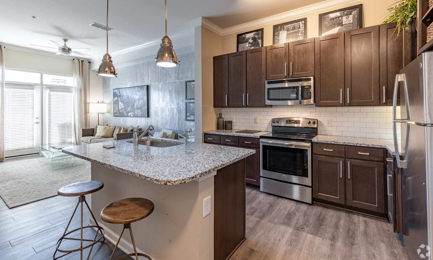 Granite kitchen island with bar stools at Ardmore & Twenty Eighth in Atlanta, Georgia 