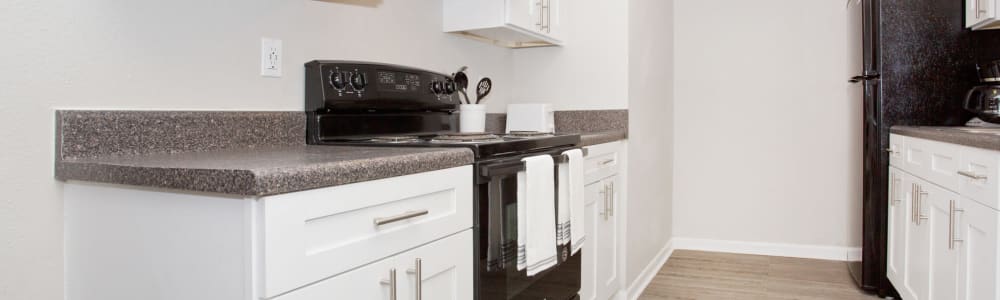White cabinets in a model apartment kitchen at Residence at Marathon in Columbus, Georgia