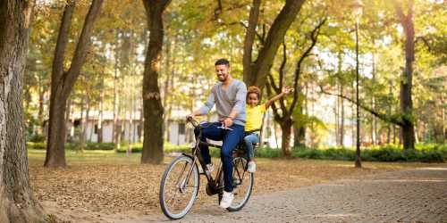 Father and child in bicycle near Ashgrove Farms Townhomes in Nicholasville, Kentucky 