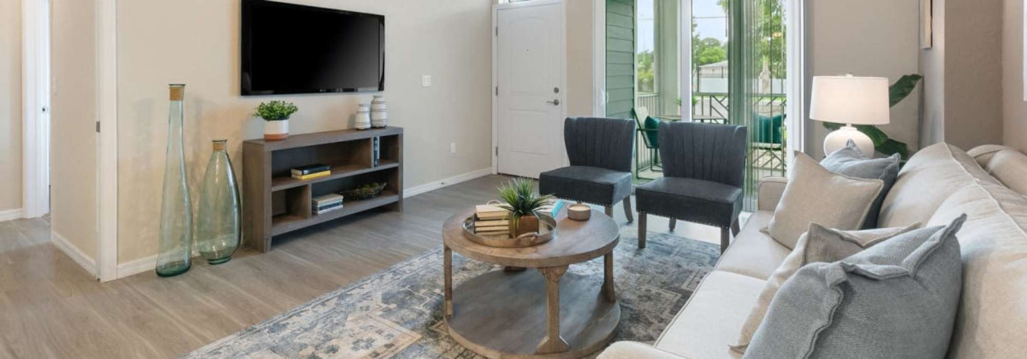 Living area with comfortable couch at The Bergamot Apartments On 780 in Sarasota, Florida