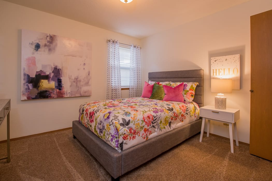 Well decorated bedroom at Huntington Park Apartments in Wichita, Kansas