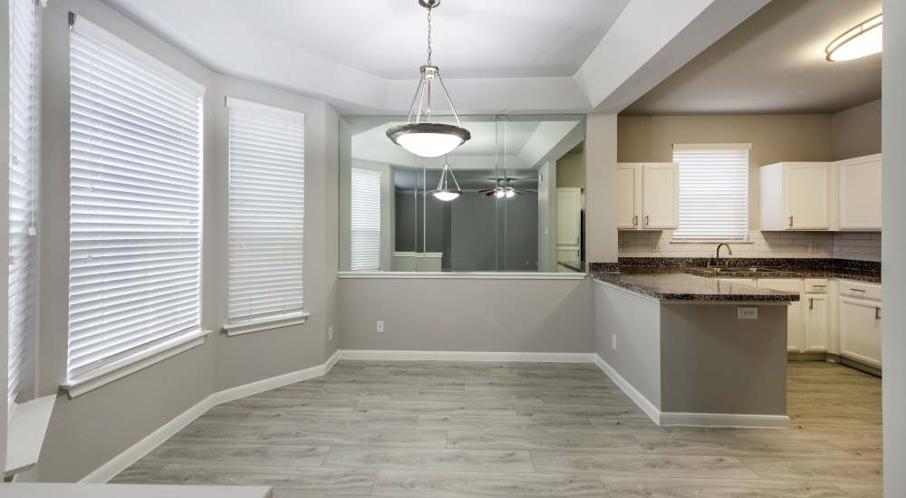 Unfurnished living room with close access to kitchen at Lakeside in Houston, Texas