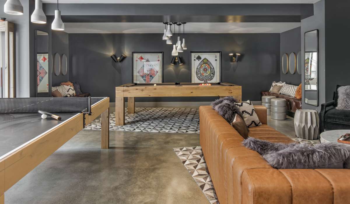 Community space with gaming equipment at The Moran in Oakland, California