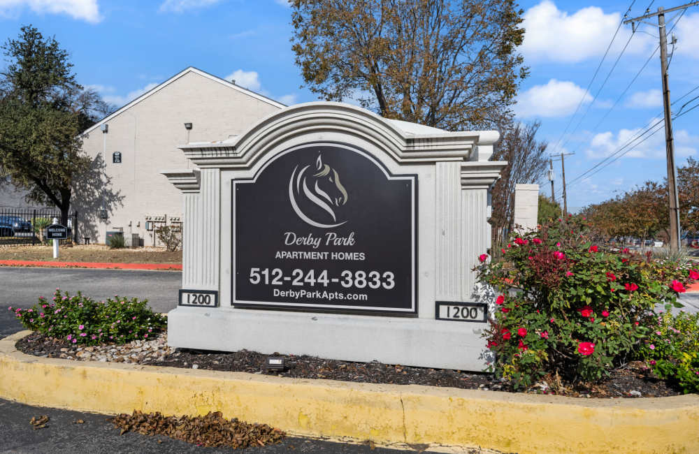 Property signage of Derby Park Apartments in Round Rock, Texas