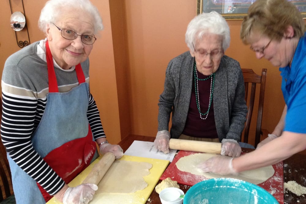 Residents rolling dough for cookies at Clover Ridge Place in Maquoketa, Iowa.