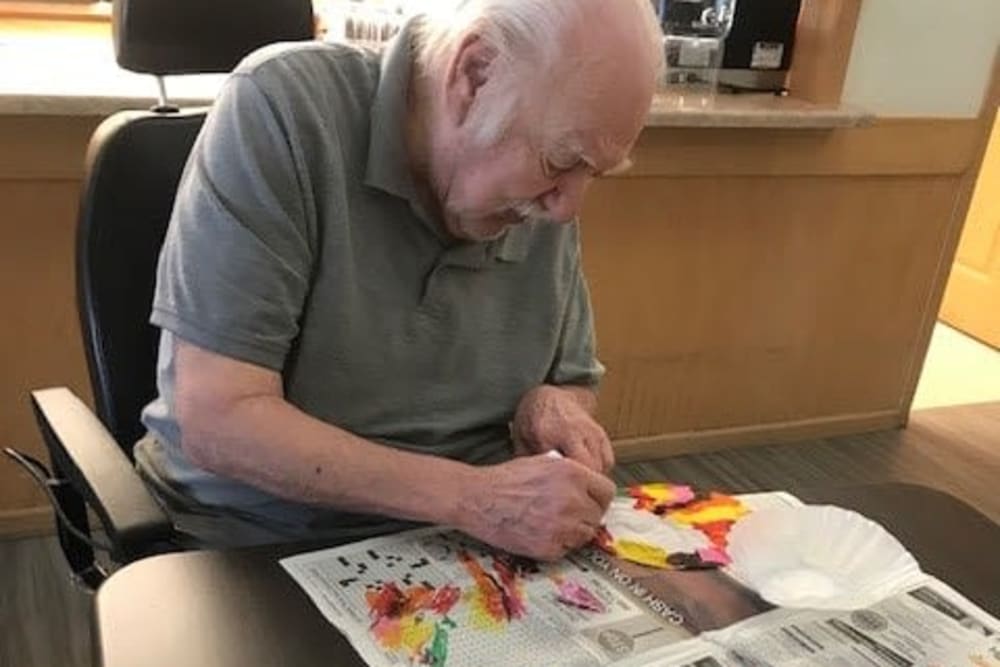 Resident creating artwork at Apple Creek Place in Appleton, Wisconsin