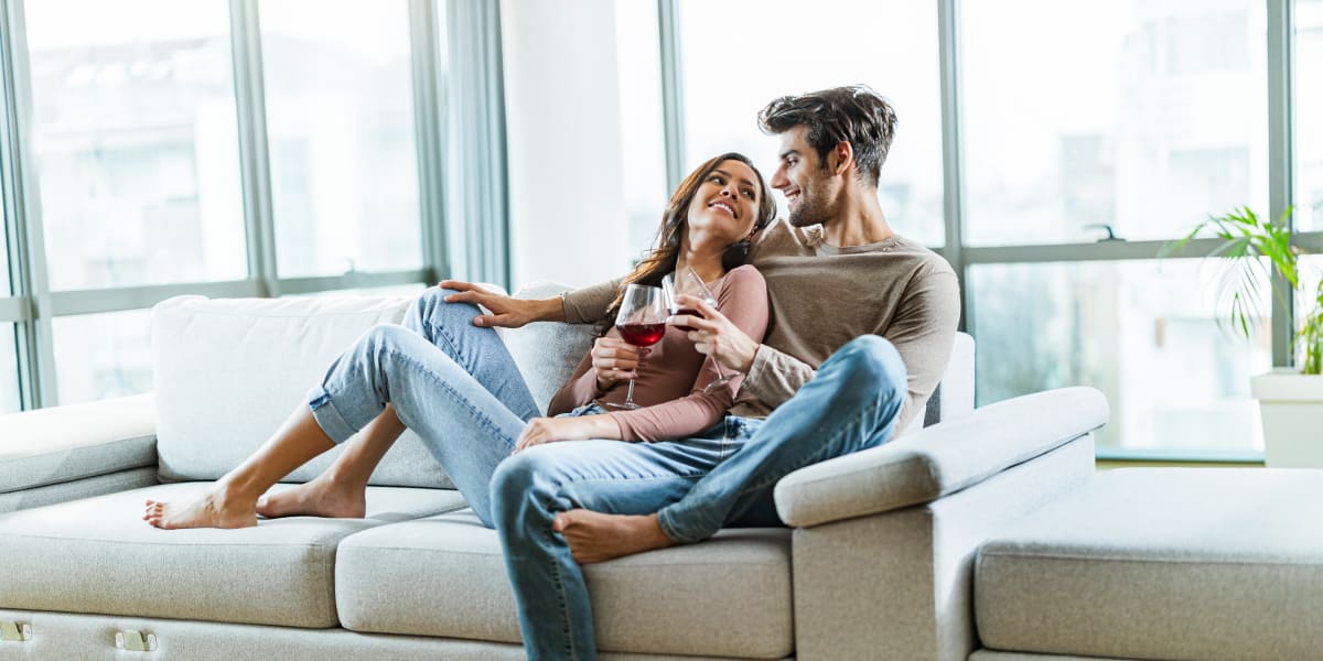 Couple laying together on a couch at The Clark in Austin, Texas