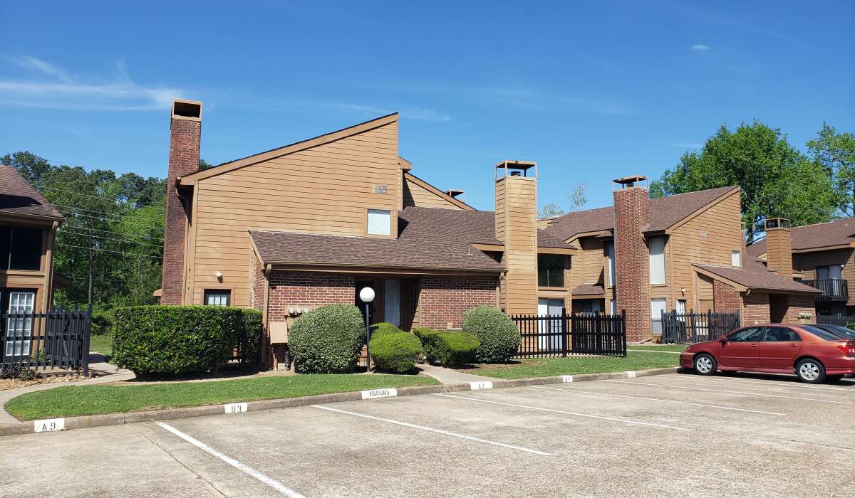 Apartment parking area at Oaks of Kingwood Apartments in Kingwood, Texas