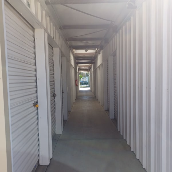Outdoor storage units with green doors at StorQuest Self Storage in Stockton, California
