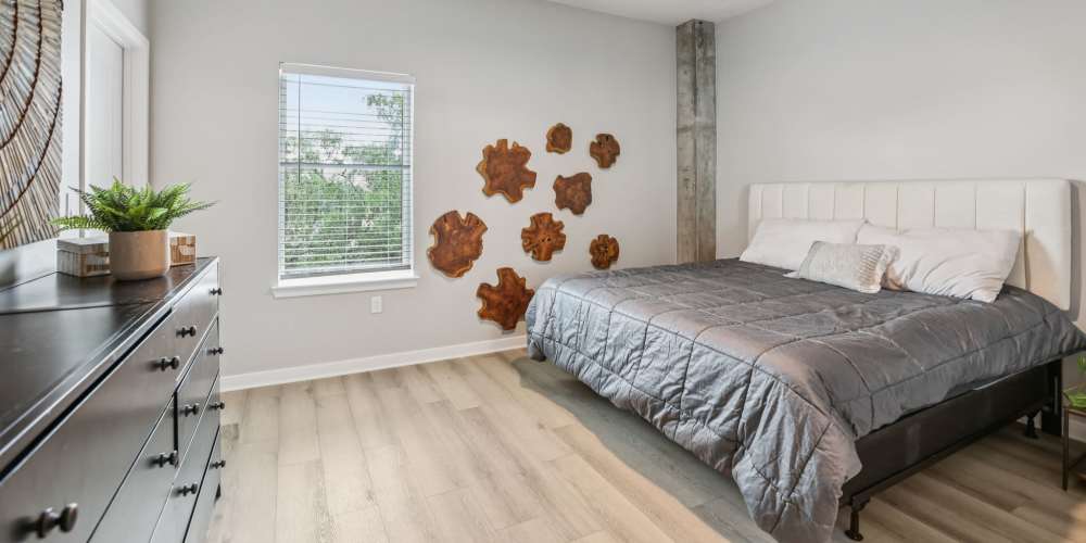 Bedroom with wooden flooring at The Breeze in Winter Haven, Florida