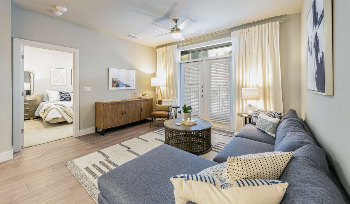 Well-lit living and with wooden flooring at The View at Belterra in Austin, Texas