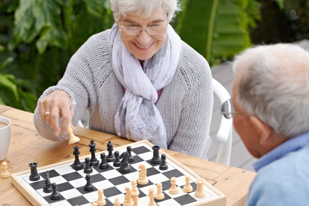 Residents playing chess together at Carnegie Heights at Henderson in Henderson, Nevada