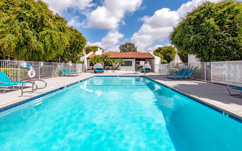 The beautiful swimming pool on a sunny day at Kendallwood Apartments in Whittier, California