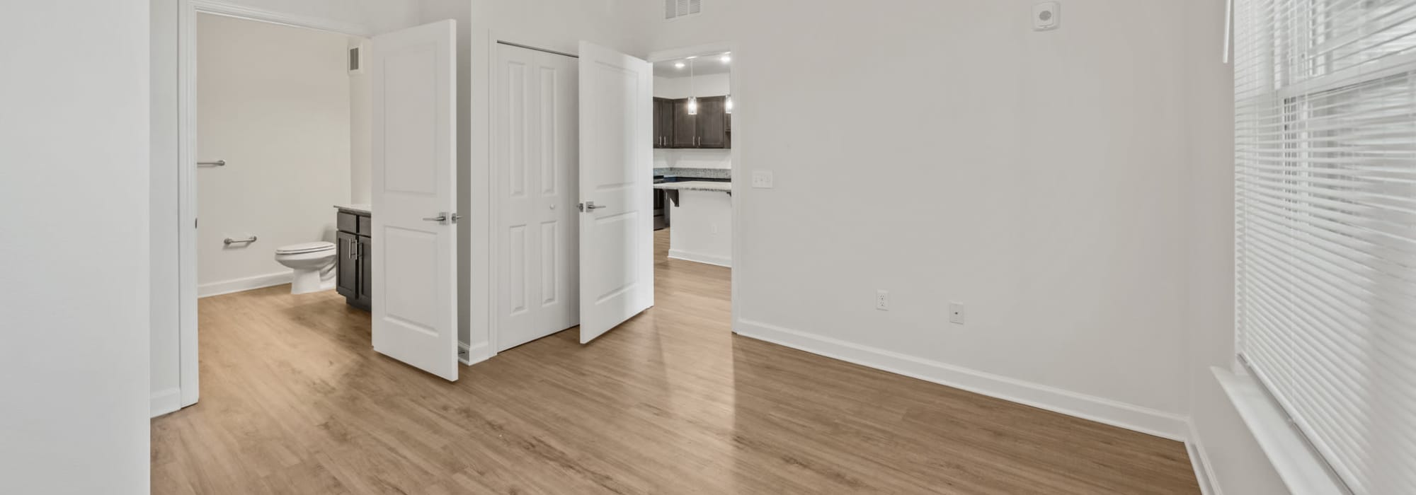 View of kitchen room from bedroom and attached bathroom at Fletcher Black in Panama City, Florida
