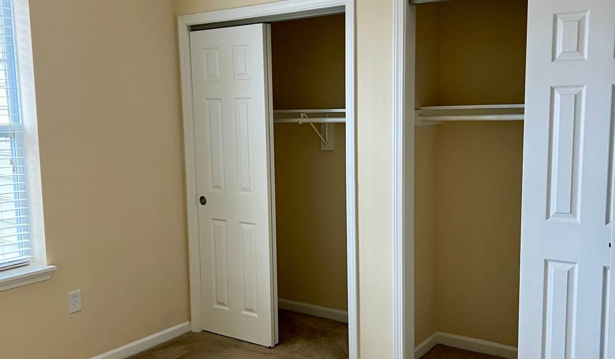 Unfurnished bedroom with closet at The Enclave Apartments in Columbus. IN