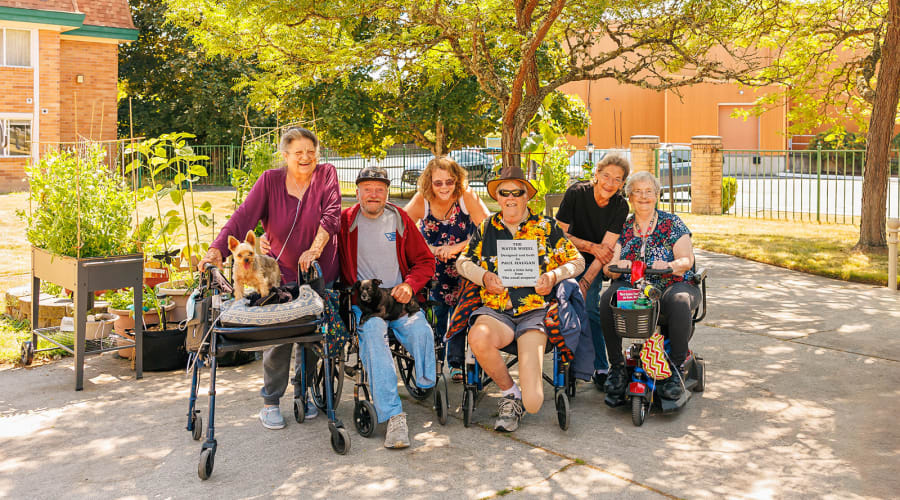 Residents walking on treadmills in a group exercise session at Peoples Senior Living in Tacoma, Washington